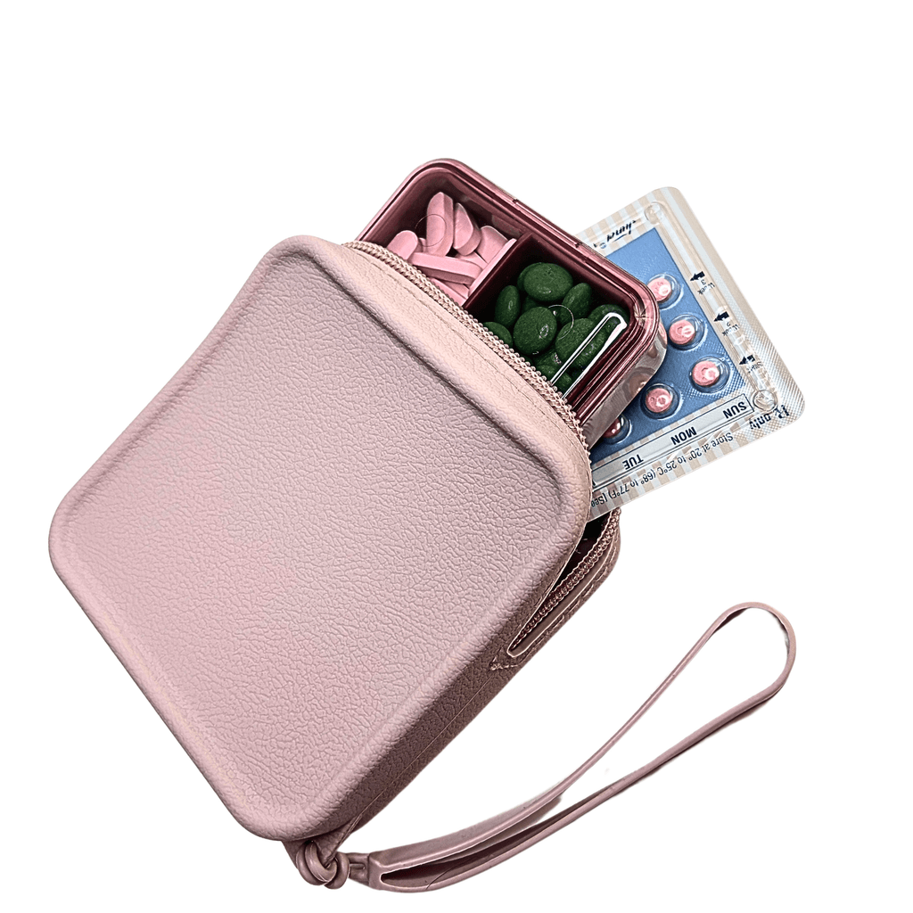 Pink pill organizer secure snap-lock lid mechanism showing airtight sealing technology with silicone zipper pouch nearby