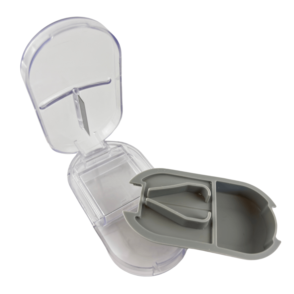 Non-slip base and ergonomic grip design of professional gray and brown pill cutting tools